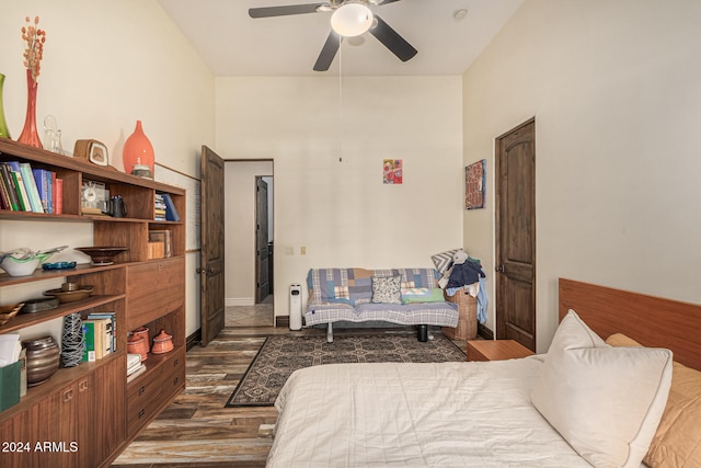 bedroom featuring ceiling fan and dark hardwood / wood-style flooring