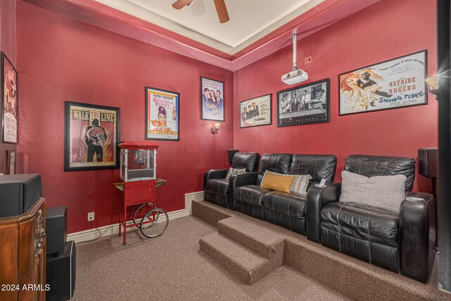 cinema room with carpet and ceiling fan