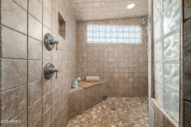 bathroom featuring a tile shower