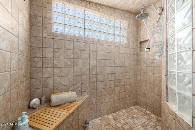 bathroom with tiled shower