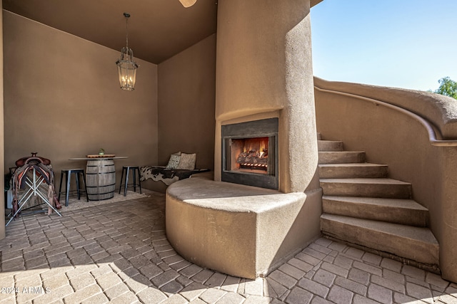 view of patio featuring a large fireplace