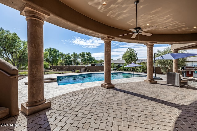 view of pool featuring a patio area and ceiling fan