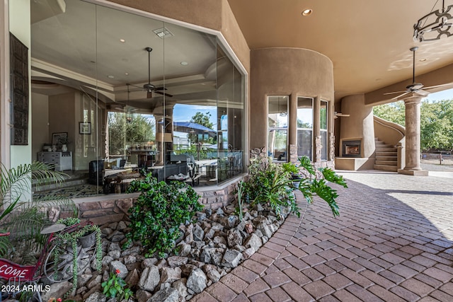 view of patio featuring ceiling fan