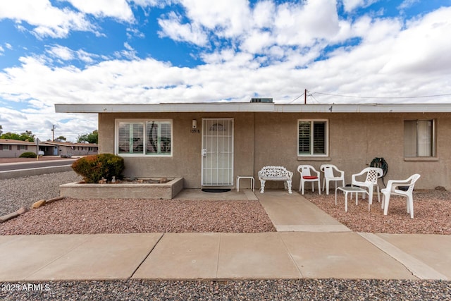 view of front of house featuring stucco siding