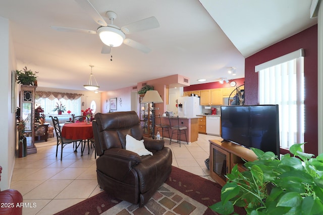 tiled living room featuring ceiling fan