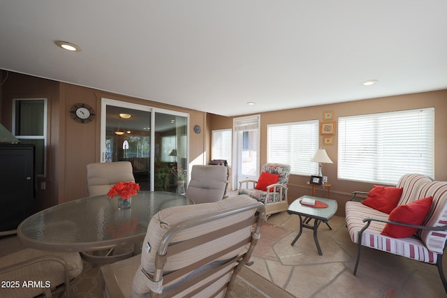 living room featuring wooden walls