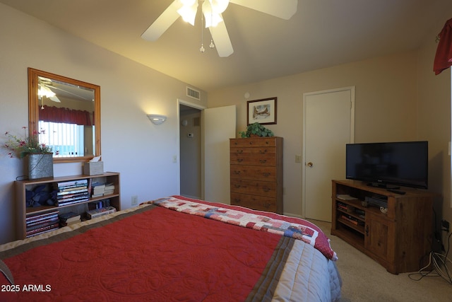 bedroom with light carpet and ceiling fan