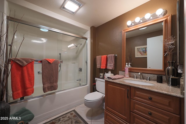 full bathroom with enclosed tub / shower combo, toilet, tile patterned floors, and vanity