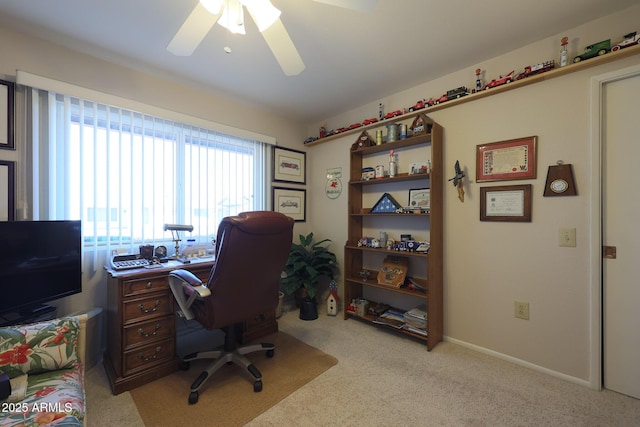 carpeted office with ceiling fan