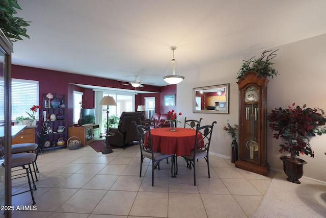 dining room featuring light tile patterned floors and ceiling fan