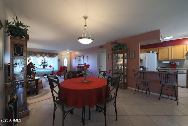 dining space with light tile patterned floors