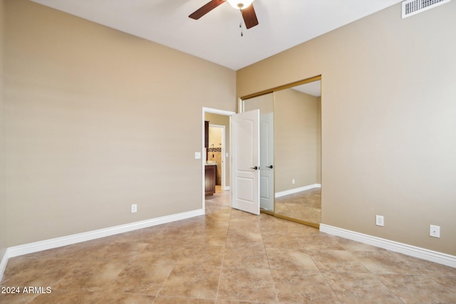 unfurnished bedroom with a closet and ceiling fan