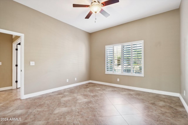 unfurnished room featuring light tile patterned flooring and ceiling fan