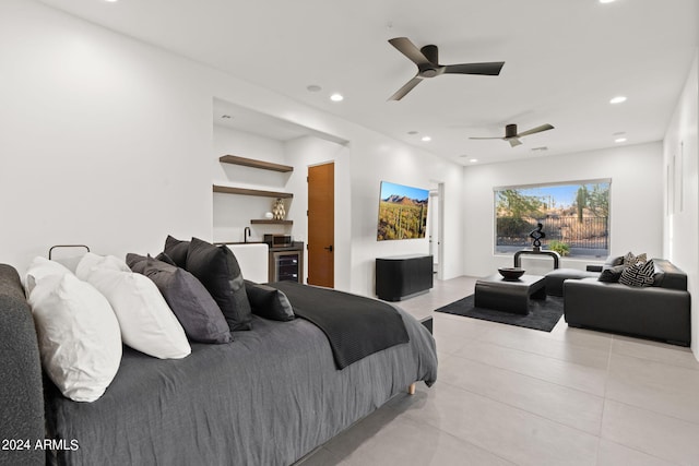 bedroom with ceiling fan and light tile patterned floors