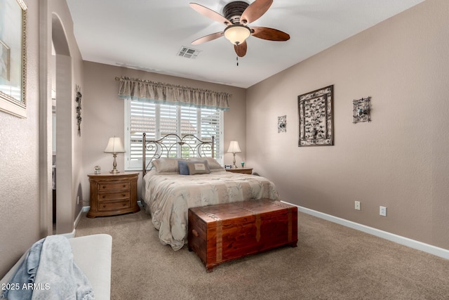 bedroom featuring light carpet and ceiling fan