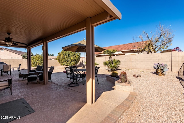 view of patio featuring ceiling fan