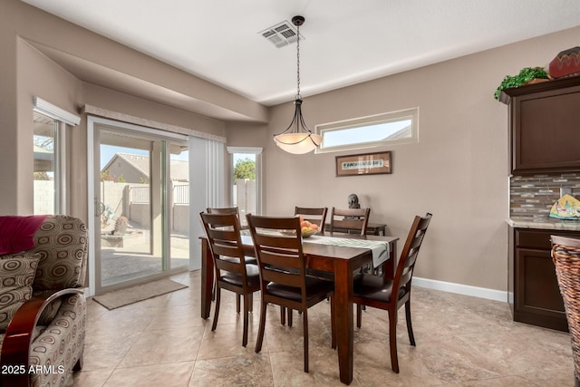 dining space with plenty of natural light