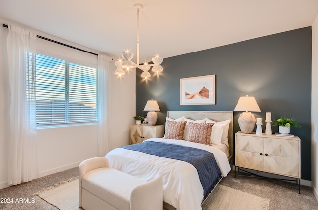 bedroom featuring carpet floors and a chandelier