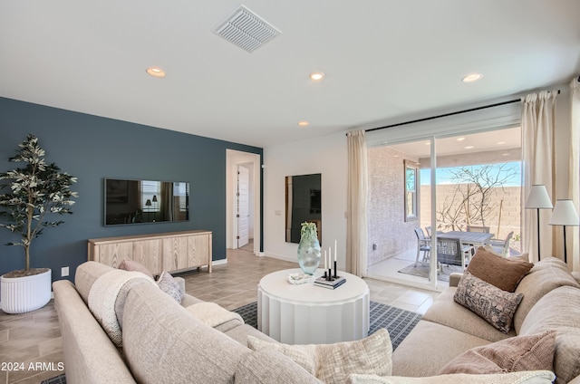 living room with light tile patterned floors