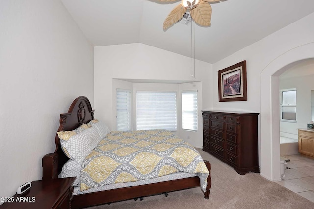 carpeted bedroom with lofted ceiling and ceiling fan