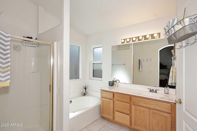 bathroom with lofted ceiling, shower with separate bathtub, tile patterned floors, and vanity