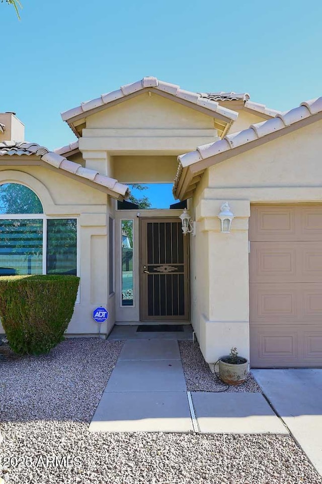 entrance to property featuring a garage