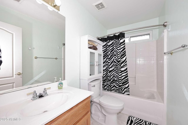 full bathroom with tile patterned floors, toilet, vanity, and shower / bath combo