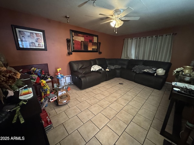 living room featuring light tile patterned flooring and a ceiling fan