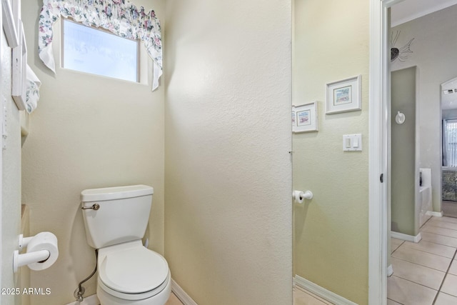 bathroom featuring tile patterned floors and toilet