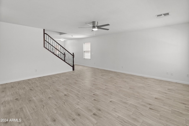 interior space with ceiling fan and light hardwood / wood-style floors