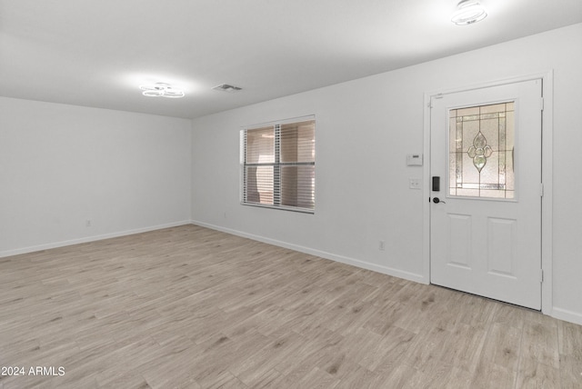 foyer with light hardwood / wood-style floors