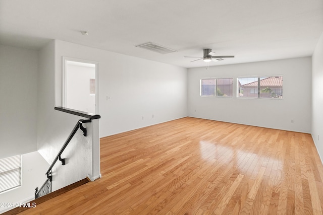 unfurnished room featuring ceiling fan and light wood-type flooring