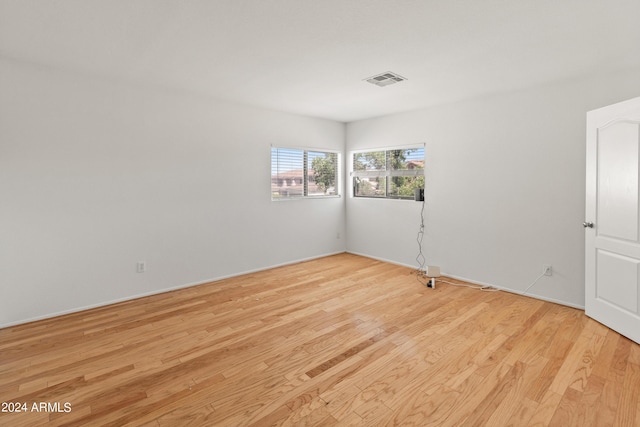 spare room with light hardwood / wood-style floors