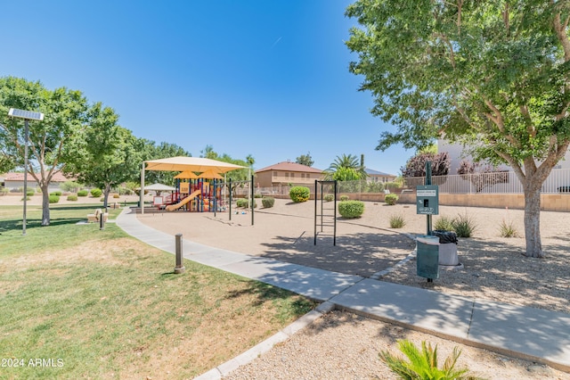 view of jungle gym featuring a lawn