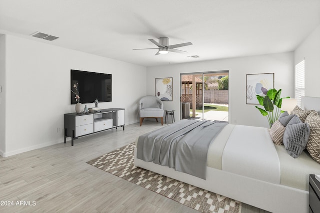 bedroom featuring ceiling fan, light hardwood / wood-style floors, and access to exterior