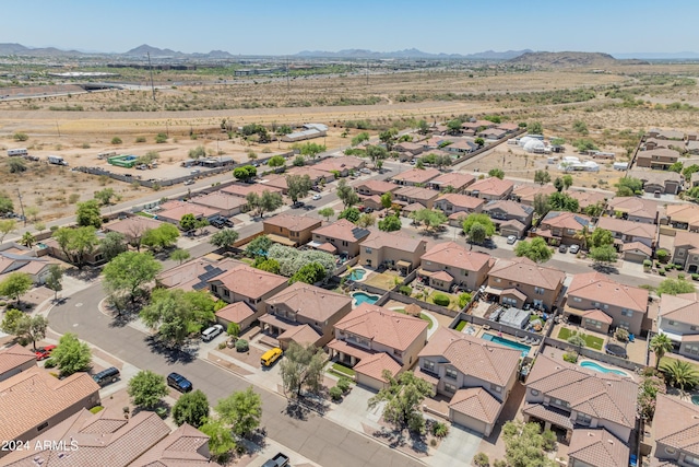 birds eye view of property with a mountain view