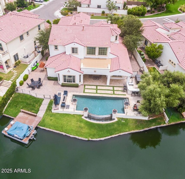 birds eye view of property with a residential view and a water view