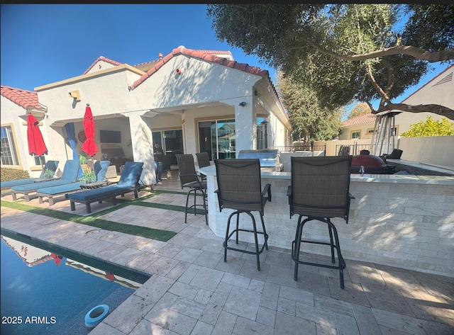 view of patio with outdoor dining area and fence