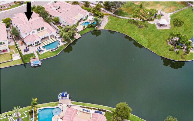 birds eye view of property with a residential view and a water view