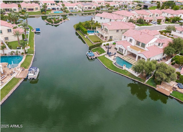 bird's eye view with a residential view and a water view