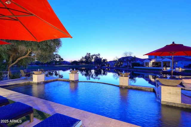 view of pool featuring a patio and outdoor dining area