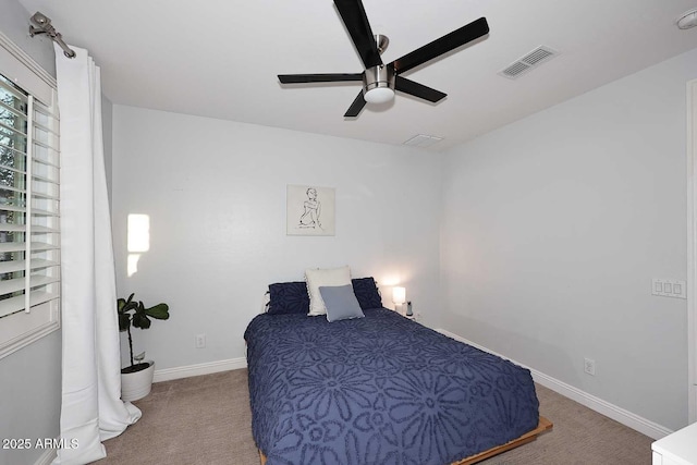 bedroom featuring visible vents, baseboards, carpet, and ceiling fan