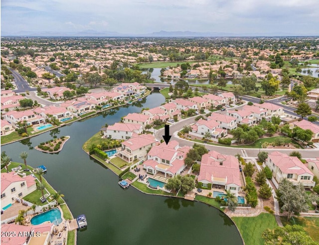 birds eye view of property with a residential view and a water view