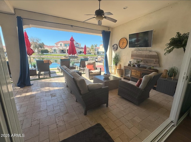 view of patio with outdoor lounge area and ceiling fan