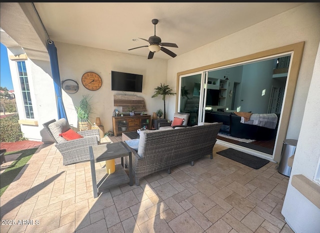 view of patio / terrace with an outdoor living space and ceiling fan