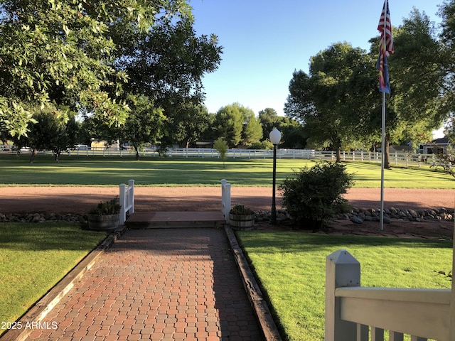 view of property's community featuring a lawn