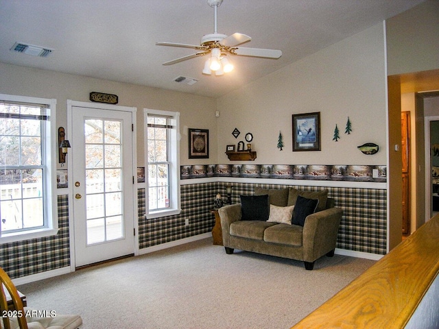 carpeted living room featuring lofted ceiling and ceiling fan