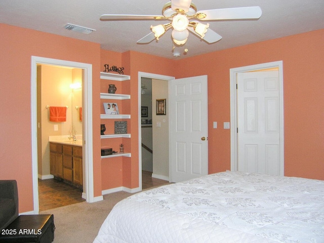 carpeted bedroom featuring ceiling fan and connected bathroom