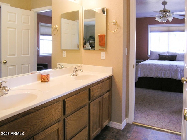 bathroom featuring ceiling fan and vanity