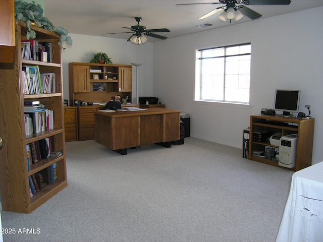 office with light carpet and ceiling fan